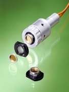 Un microphone avec transfert optique des données Un microphone avec transfert des données par fibres optiques