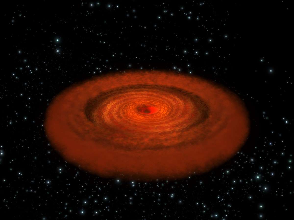 Illustration montrant un trou noir supermassif au centre d'une galaxie. On pensait que le trou noir au centre de la galaxie – connu sous le nom de 1H0707-495 – devait être à jamais caché par le disque de gaz et de poussières qui l’entoure. Les observation de XMM Newton ont montré que ce n’est pas le cas, comme l’explique un groupe d’astronomes dans le journal Nature. Crédit: Esa/C. Carreau