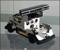 L'interface Kinect, de la XBox, pilote une voiture miniature Une Robocar surmontée d'un module Kinect. Un bricolage en apparence seulement, qui pourra servir de banc de test pour des roboticiens. © ZMP