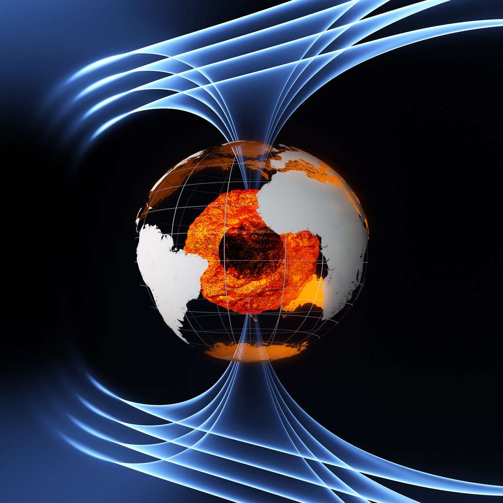 Une vue d'artiste de l'intérieur de la Terre et des lignes de champs de sa magnétosphère. Les couches supérieures du noyau sont très chaudes et liquides. La graine, au centre, est solide mais sa température peut atteindre celle de la surface du soleil. © ESA/AOES Medialab