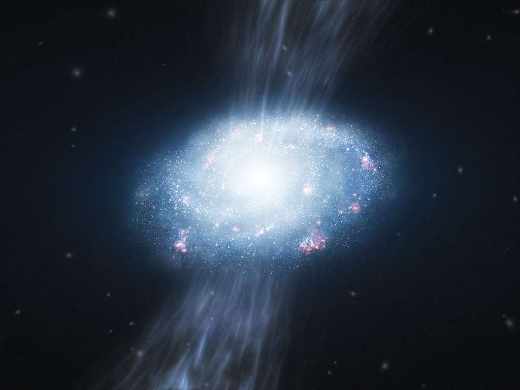 La croissance des premières galaxies ne se serait pas faite uniquement par un processus de fusion entre les galaxies naines. Sur cette image d'artiste, on voit deux courants de gaz froids alimentant les zones centrales d'une galaxie et y produisant la formation de nouvelles étoiles. © ESO/L. Calçada