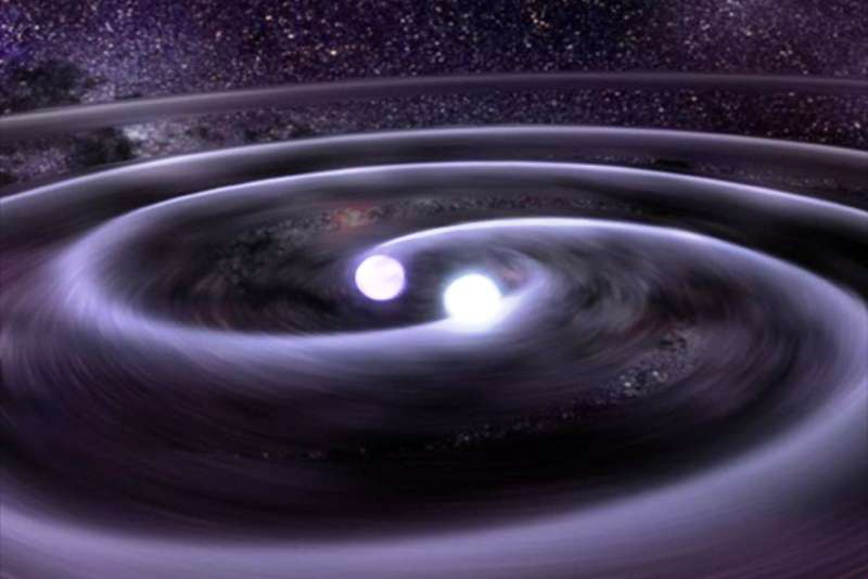 Une image de synthèse extraite de la représentation d'une collision de deux naines blanches. On a représenté ici les ondes gravitationnelles faisant osciller le tissu de l'espace-temps comme des vagues sur l'eau, juste avant la collision des deux astres compacts. En emportant de l'énergie, ces ondes font décroître la taille de l'orbite d'un système binaire constitué d'astres compacts jusqu'à ce qu'une collision se produise. © GSFC/D. Berry