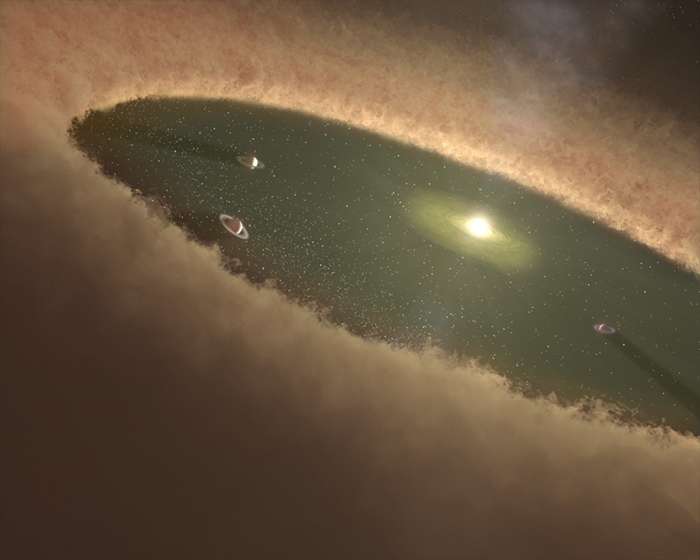 Cette vue d’artiste donne une idée de la manière dont une instabilité a bouleversé la structure de notre Système solaire alors que le nuage de gaz et de poussière qui a vu naître notre Soleil se dissipait. © Nasa, JPL-Caltech, T. Pyle (SSC)