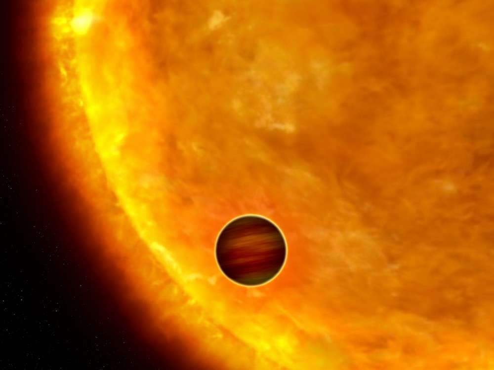 Le transit d'une exoplanète entre son étoile et la Terre permet de rechercher des éléments constituant son atmosphère. Crédit Nasa / Esa / G. Bacon