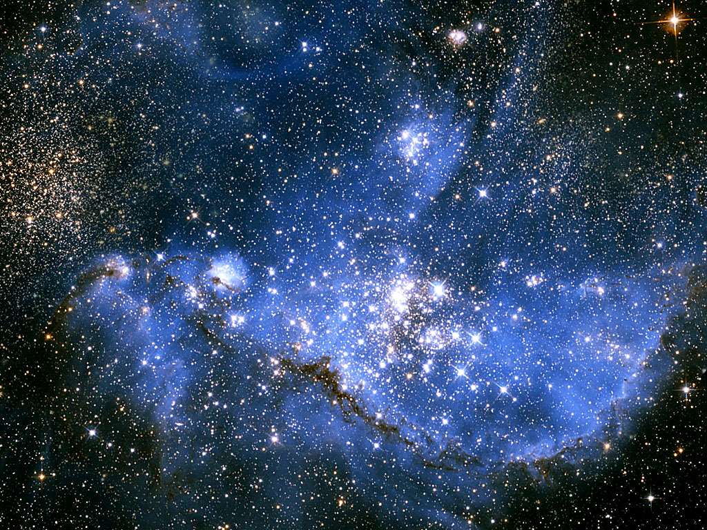 NGC 346 est une nébuleuse et un amas ouvert d'étoiles dans le Petit Nuage de Magellan observé ici avec Hubble. Situé à plus de 21.000 années-lumière du Soleil, cet objet astronomique ne pourrait être visité par l'humanité en un temps raisonnable que si elle découvrait le secret du voyage interstellaire à des vitesses bien supérieures à celles de la lumière. © Nasa