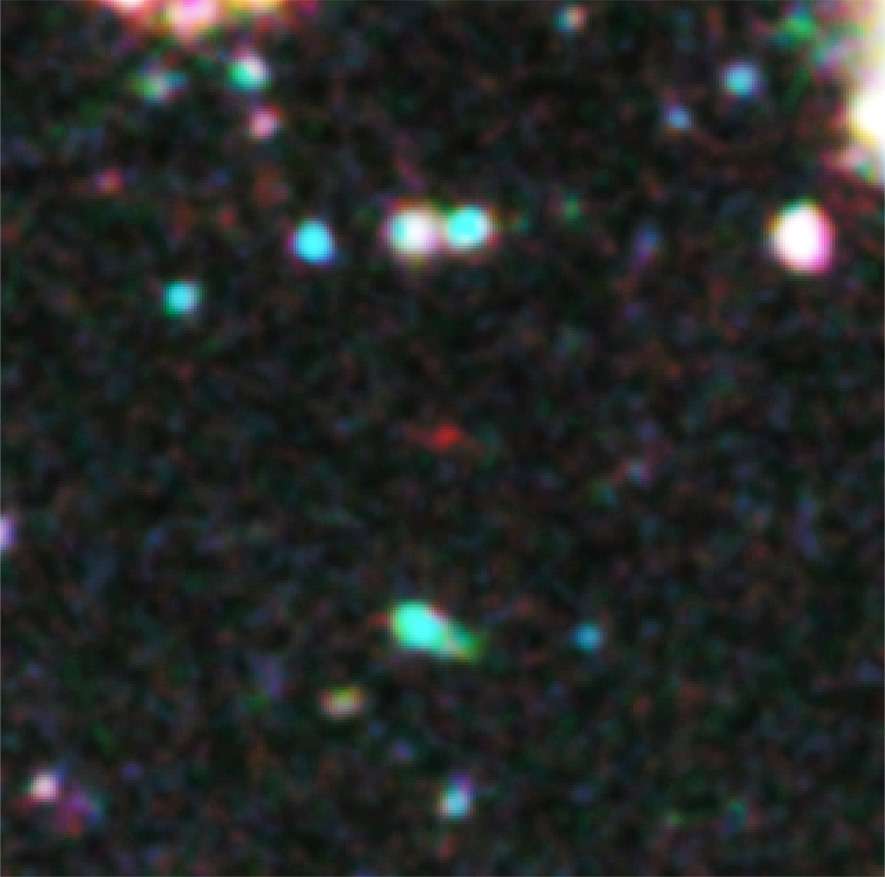 Le point rouge est la galaxie en question. Son décalage, ou redshift, serait de 10,3. Sa lumière aurait mis 13,2 milliards d'années à nous parvenir. Elle fait partie des premières galaxies de l'univers. © Nasa, Esa, G. Illingworth (University of California, Santa Cruz), R. Bouwens (University of California, Santa Cruz, Leiden University)/HUDF09 Team
