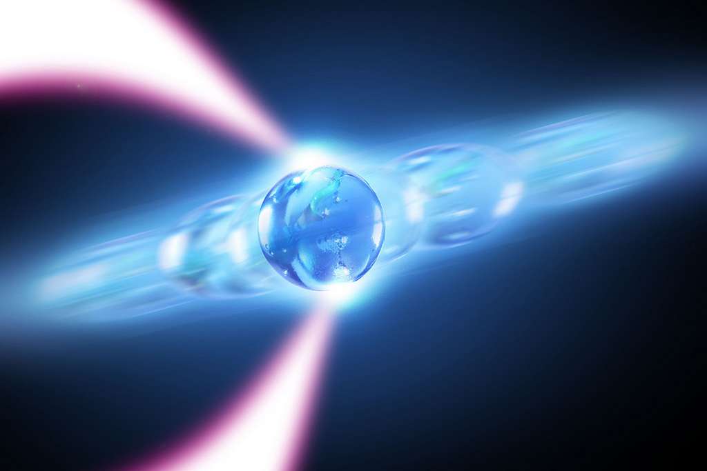 Des chercheurs ont mis au point un laser à phonons à l’aide d’une pincette optique, comme celle illustrée ici, et d’une nanoparticule en lévitation. © A. Nick Vamivakas and Michael Osadciw, University of Rochester illustration
