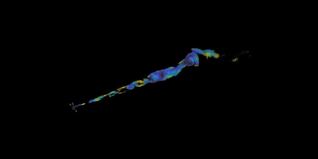 Cette image en fausses couleurs du VLA montre un jet dans le domaine radio provenant de la galaxie M87 en utilisant les propriétés de polarisation de la lumière pour tracer les lignes de champ magnétique dans le jet. Ces lignes suivent la structure en double hélice. Une analyse supplémentaire montre que la direction des champs magnétiques est différente sur les bords opposés du jet, soutenant la conclusion que le champ magnétique est hélicoïdal, comme un tire-bouchon. © Pasetto et al., Sophia Dagnello, NRAO/AUI/NSF