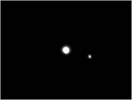 Pluton, à gauche, et son compagnon, Charon. Crédit : D; Tholen
