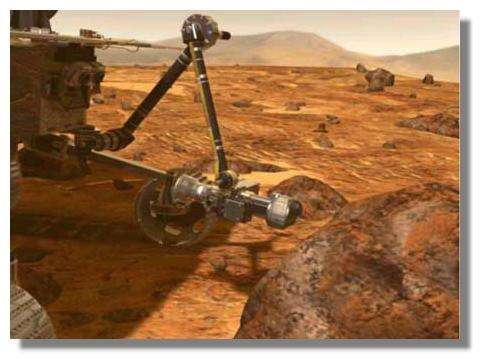 Le rover MER approche le bras articulé portant la ponceuse près de la roche à analyser. © NASA / JPL