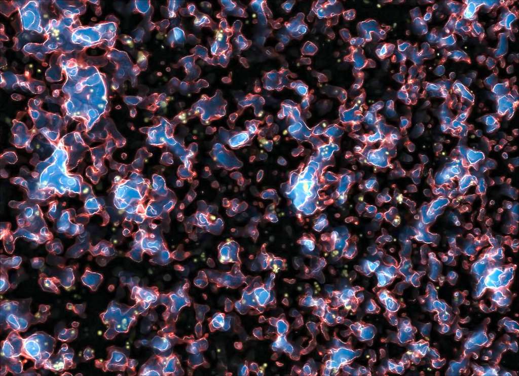 Une image extraite de la simulation montrant la réionisation de l'univers observable sous l'influence du rayonnement ultraviolet des galaxies, quelques centaines de millions d'années après la recombinaison et l'émission du rayonnement fossile. Les zones ionisées par le rayonnement UV, et qui sont devenues translucides, sont en bleu. Les régions opaques aux UV, contenant encore de l'hydrogène et de l'hélium neutres, sont en noir. Le front d'ionisation est quant à lui représenté en rouge et blanc. Une vidéo complète de cette simulation se trouve sur le site de son auteur, Marcelo Alvarez. © M. Alvarez, R. Kaehler et T. Abel