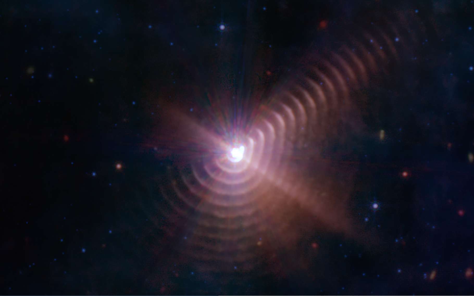 17 anneaux de poussière autour d'une étoile double mystérieuse scrutés par le télescope James-Webb