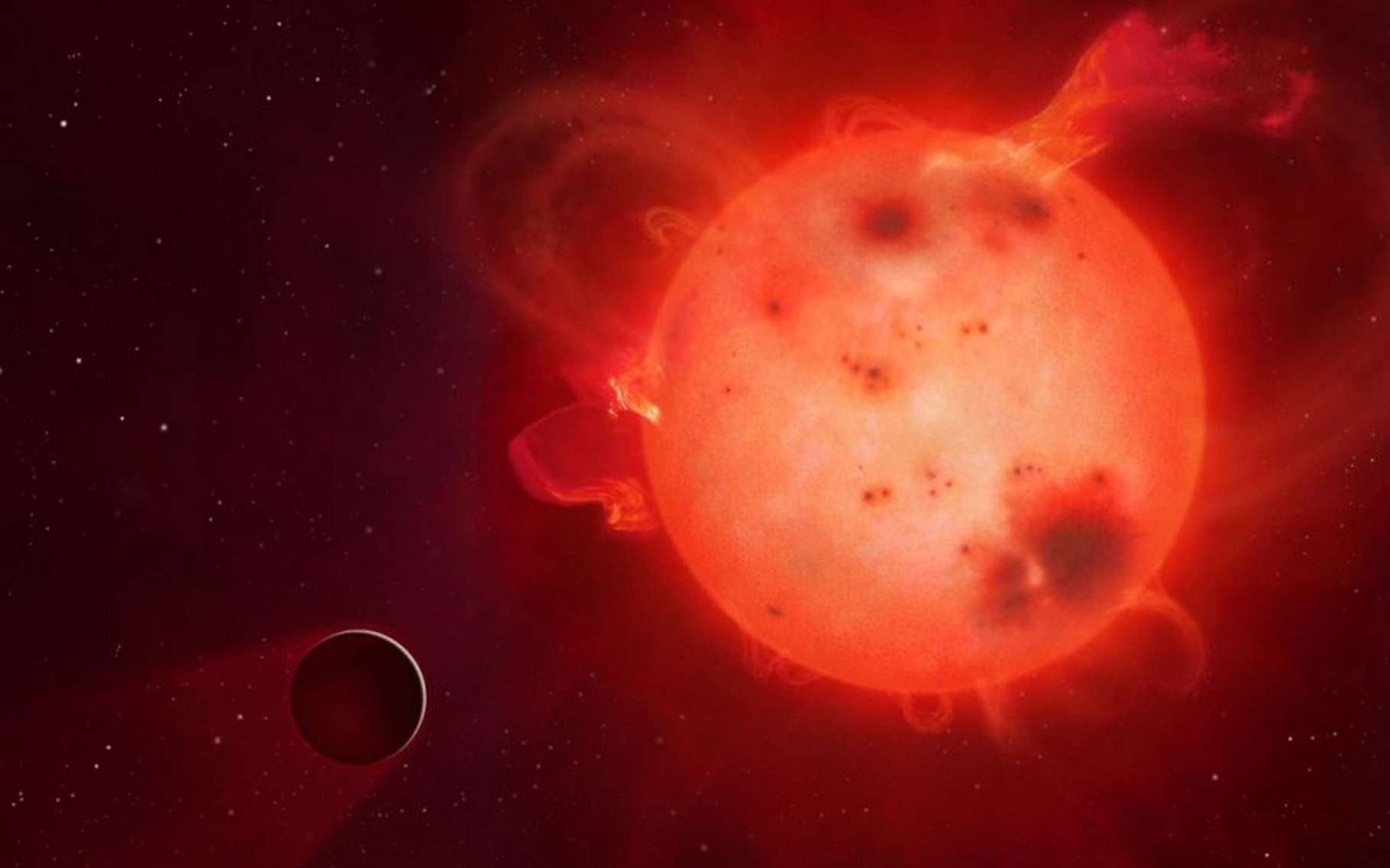 L'exoplanète Kepler-438b (représentée ici dans une vue d'artiste) ressemble beaucoup à la Terre mais elle tourne, à faible distance, autour d'une naine rouge paraissant assez colérique. La vie est-elle possible tout près de ces petites étoiles, largement majoritaires ? Des modèles climatiques répondent oui, mais à certaines conditions. © Mark A. Garlick, university of Warwick