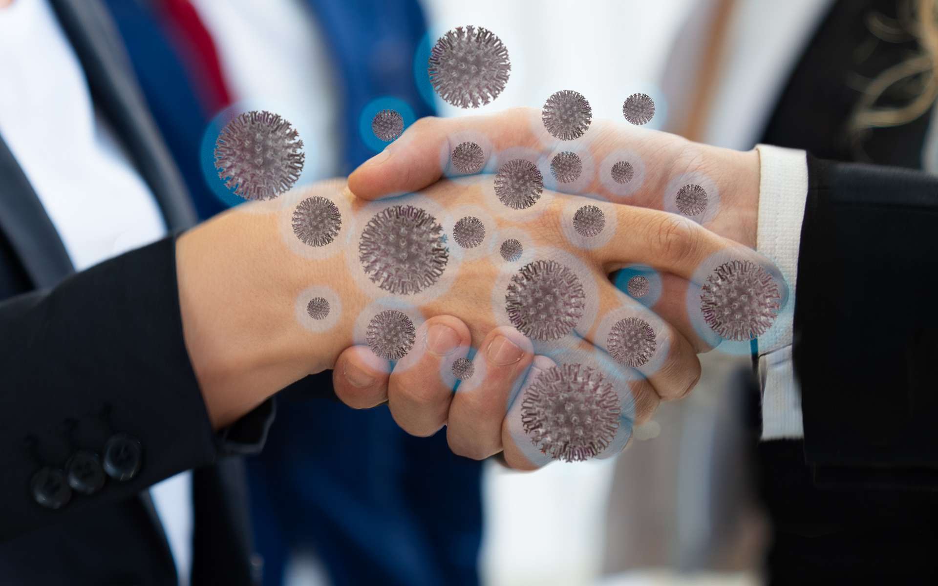 Modèle de transmission du Coronavirus au cours d'une poignée de main. © franck29052515, Adobe Stock