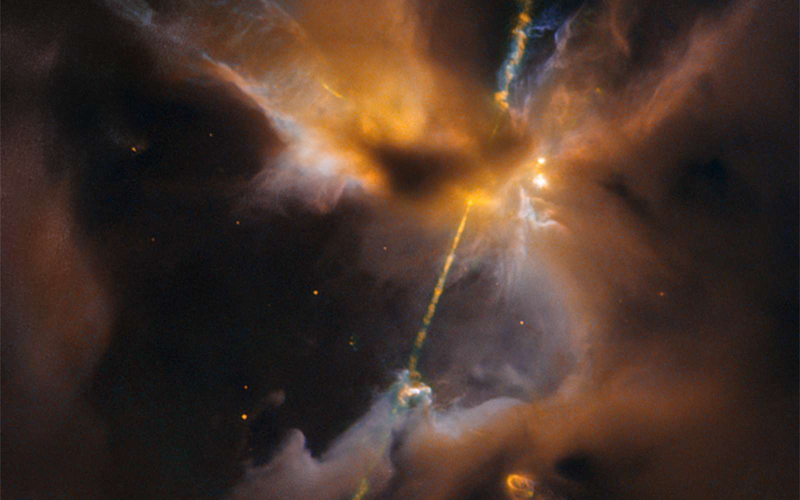 Ce double sabre laser est un objet Herbig-Haro, deux puissants jets expulsés d’une très jeune étoile, qui entrent en collision avec la matière interstellaire. Téléchargez ici l’image en haute résolution. © Nasa, Esa