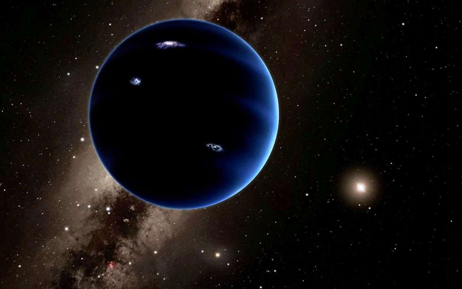 Une vue d'artiste de la neuvième planète qui existe peut-être à plus de 200 fois la distance de la Terre au Soleil, loin au-delà de l'orbite de Pluton. Sa masse est estimée à environ 10 fois celle de la Terre. Elle devrait, logiquement, être enveloppée par une épaisse atmosphère d'hydrogène et d'hélium qui la ferait ressembler à Neptune. © Caltech, R. Hurt (Ipac)