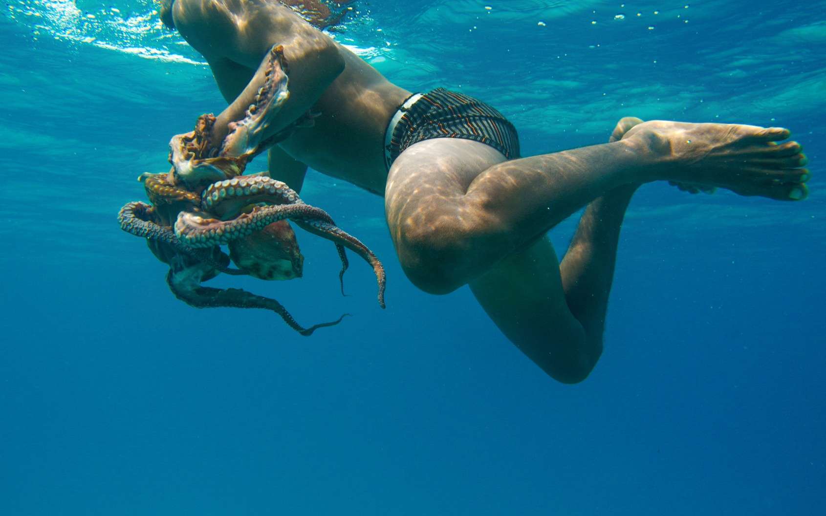 Un pêcheur Bajau a attrapé une pieuvre. © Giudici Roberto, Fotolia