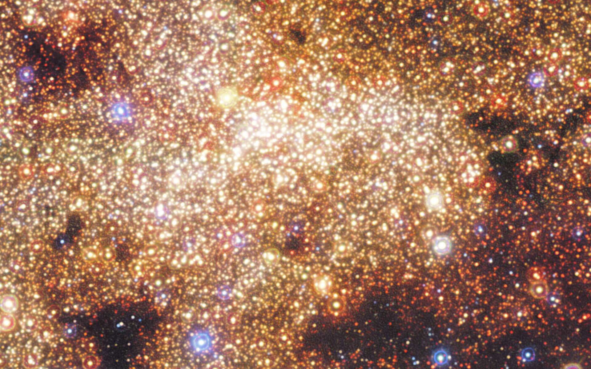 Il y a un milliard d’années, le centre de notre Voie lactée a connu une période d’intense activité. Une flambée de formation stellaire semblable à celle qui se produit dans les galaxies les plus brillantes de notre univers. © Nogueras-Lara et al., ESO