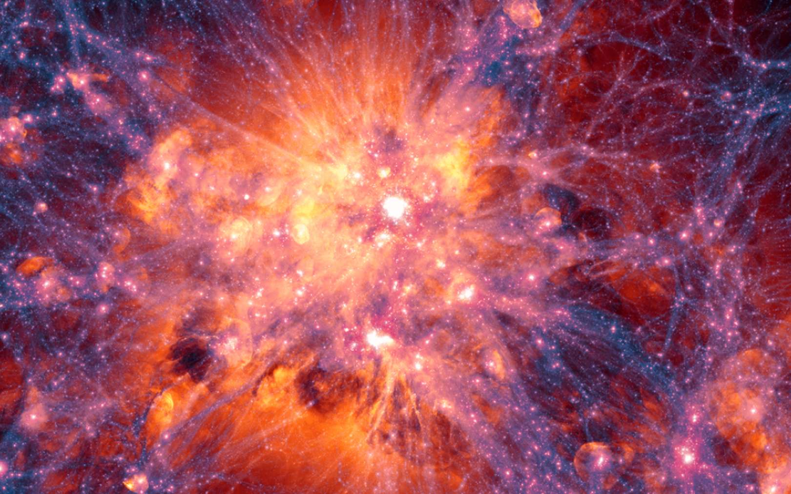 Les protons perdus du Big Bang ont-ils enfin été retrouvés ? Ici, projection à grande échelle centrée sur l’amas de galaxies le plus massif dans la simulation Illustris. Elle montre la distribution de la matière noire en filaments (bleu, violet et pourpre), laquelle interagit gravitationnellement avec la matière ordinaire et favorise la formation des amas de galaxies. Les enveloppes de gaz teintées de rouge, rose ou orange sont principalement créées par l’explosion de supernovae ou les jets des trous noirs supermassifs. © Illustris Collaboration