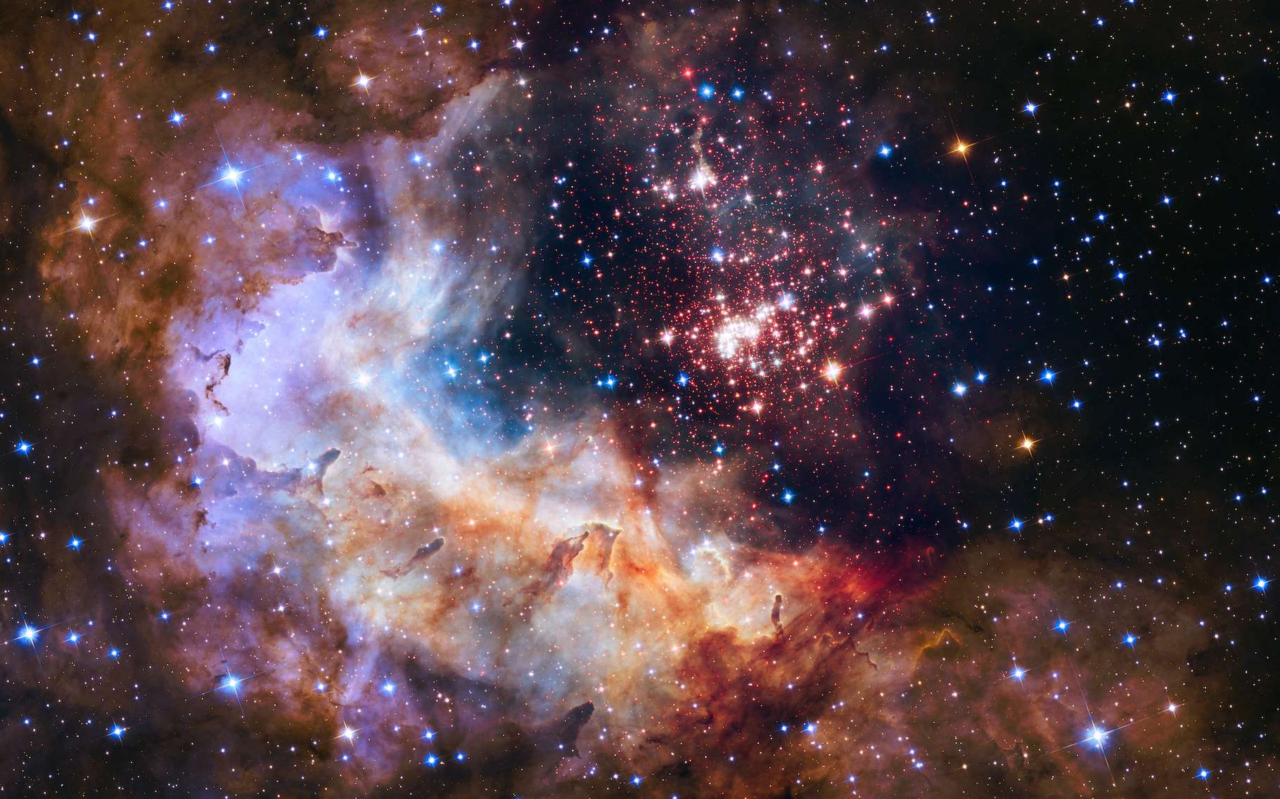 Cette image a été publiée pour fêter les 25 ans du télescope spatial Hubble. On y découvre l’amas de Westerlund 2 que des chercheurs de l’université du Maryland (États-Unis) viennent d’éclairer d’une nouvelle lumière. © NASA, ESA, the Hubble Heritage Team (STScI/AURA), A. Nota (ESA/STScI), and the Westerlund 2 Science Team