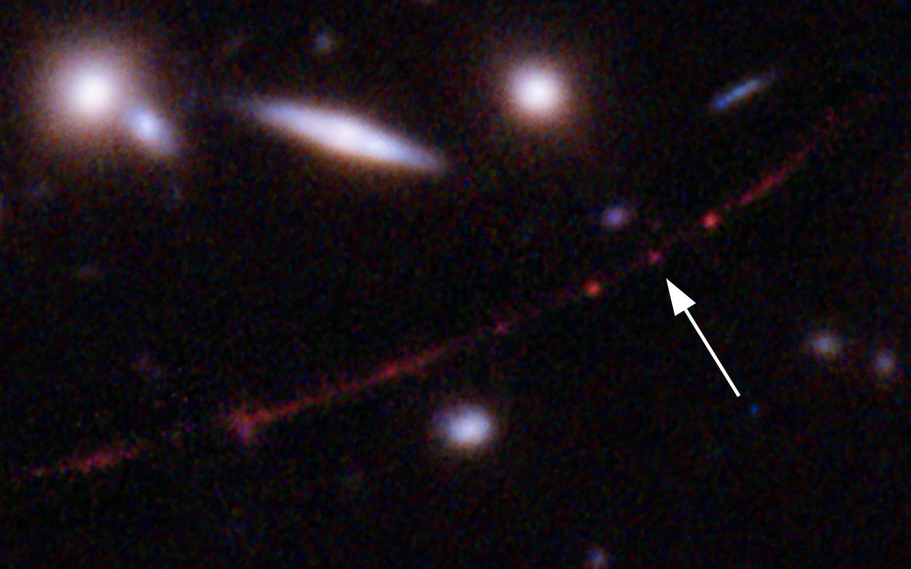 La flèche indique la localisation de l'étoile Earendel. © Sciences : Nasa, ESA, Brian Welch (JHU), Dan Coe (STScI), traitement de l'image : Nasa, ESA, Alyssa Pagan (STScI)