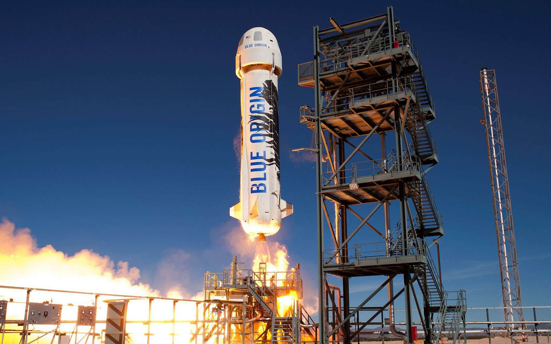 Le New Shepard de Blue Origin au décollage. Ce véhicule suborbital est composé d'un étage propulsif et d'une capsule aménagée pour transporter des touristes et des charges utiles, comme des expériences scientifiques ou des démonstrations de technologies. © Bue Origin
