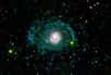 Une nouvelle image de Galex (Galaxy Evolution Explorer) montre qu'une galaxie que l'on pensait être plutôt simple et vieille est dotée en réalité d'un jeu magnifique de jeunes bras en spirale.