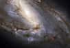 Quelques jours avant son vingtième anniversaire, le télescope spatial Hubble nous propose une vision extrêmement détaillée d'une galaxie très particulière, M 66.