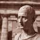 Cicéron, dont le nom complet est Marcus Tullius Cicero, est un homme politique, avocat, écrivain et philosophe romain. Il est né le 3 janvier 106 av. J.-C. à Arpinum, dans une famille de la petite noblesse italienne et meurt assassiné le 7 décembre 43 av. J.-C. à Formia. Cicéron est connu pour ses talents oratoires et sa maîtrise de la rhétorique, qui lui ont valu une renommée considérable à l'époque de la République romaine.Les débuts et la formation intellectuelle de CicéronMarcus Tullius Cicero est né le 3 janvier 106 av. J.-C. à Arpinum, une petite ville de l'Italie centrale. Il provenait d'une famille de la petite noblesse romaine. Dès son plus jeune âge, Cicéron manifesta des talents exceptionnels pour l'éloquence et la rhétorique. Il reçut une éducation soignée et complète, se familiarisant avec les œuvres des grands auteurs grecs et romains. Il étudia également la philosophie, se tournant vers le stoïcisme, qui allait influencer profondément sa pensée.Une fois sa formation achevée, Cicéron se lança dans une carrière d'avocat et se fit rapidement remarquer par ses compétences oratoires exceptionnelles. Son éloquence et sa maîtrise de la rhétorique lui valurent une réputation croissante, lui permettant de se hisser rapidement parmi les figures éminentes du barreau romain. Cela lui offrit également des opportunités dans le domaine politique, où son talent pour la persuasion verbale allait bientôt briller de tous ses feux.La carrière politique et l'art oratoire de Cicéron La carrière politique de Cicéron décolla véritablement lorsqu'il fut élu questeur en 75 av. J.-C. Il occupa ensuite les postes d'édile curule et de préteur, se distinguant par sa compétence, son intégrité et son dévouement au bien public. Cependant, c'est en tant que consul, en 63 av. J.-C., que Cicéron atteignit les plus hautes sphères du pouvoir. Durant son consulat, il s'employa à rétablir l'autorité de l'État et à combattre la corruption qui minait la République romaine.Les discours de Cicéron sont parmi ses réalisations les plus notables. Son style oratoire captivant et persuasif lui a valu de nombreuses victoires judiciaires, lui permettant d'acquérir une immense popularité auprès du public romain. Ses discours, tels que les célèbres Catilinaires contre le conspirateur Catilina, sont restés des modèles d'éloquence et sont étudiés étudiés et admirés par de nombreuses générations.Les défis politiques, la chute et l'héritage de CicéronLa fin de la vie de Cicéron fut marquée par des défis politiques majeurs. Il s'opposa à l'ascension de Jules César, craignant la montée en puissance d'un homme fort qui menacerait la République. Cependant, après l'assassinat de César en 44 av. J.-C., Cicéron soutint brièvement les assassins, mais se retrouva rapidement marginalisé lorsque Marc Antoine et Octave (le futur empereur Auguste) s'imposèrent.Cicéron fut alors déclaré ennemi de l'État par le triumvirat formé par Marc Antoine, Octave et Lépide. Conscient du danger imminent, Cicéron chercha à fuir l'Italie, mais fut finalement capturé et exécuté le 7 décembre 43 av. J.-C. Sa mort marqua la fin tragique d'une vie dédiée à la politique et à la défense féroce des idéaux républicains.L'héritage de Cicéron demeure toutefois immense. Ses écrits philosophiques, politiques et rhétoriques ont influencé la pensée occidentale pendant des siècles. Sa défense de la liberté, de l'éloquence et de la primauté du droit a inspiré de nombreux penseurs, politiciens et avocats. Cicéron demeure une figure emblématique de la Rome antique et son impact perdure encore de nos jours.