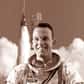 Il fut l'un des sept astronautes du groupe baptisé « The Original Seven » constitué dans le cadre du programme Mercury. Les 15 et 16 mai 1963, il pilote la capsule Faith 7 pour la dernière mission de la phase opérationnelle du projet Mercury. Il bat au cours de ce vol de 22 orbites le record américain de la mission la plus longue (34 heures, 19 minutes et 49 secondes), et il est le premier astronaute américain à dormir en orbite.