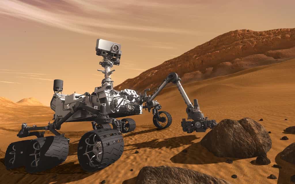 Le rover Curiosity, dessiné sur son terrain de chasse, dans le cratère Gale, où il travaille depuis maintenant cinq ans. © Nasa, JPL