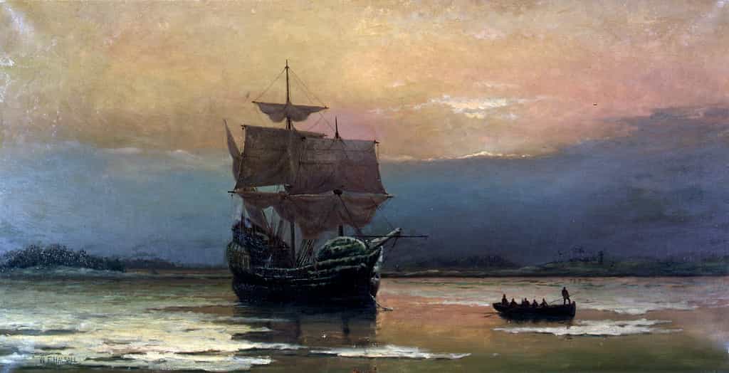 Le navire Mayflower arrivant dans la baie de Plymouth en 1620. Des colons débarquent dans une chaloupe. Tableau peint par William Halsall en 1882, Pilgrim Hall Museum, Plymouth, Massachusetts, États-Unis. © Wikimedia Commons, domaine public.