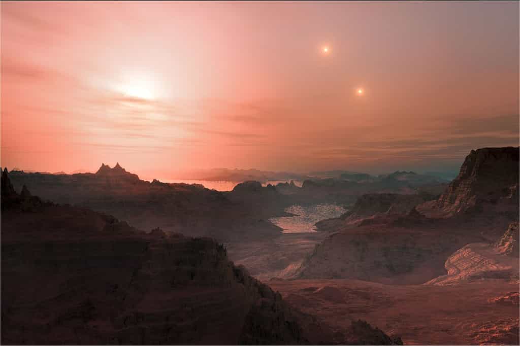 Une vue d'artiste d'un ciel éclairé par une naine rouge sur une planète tellurique, quelque part dans la Voie lactée... © ESO