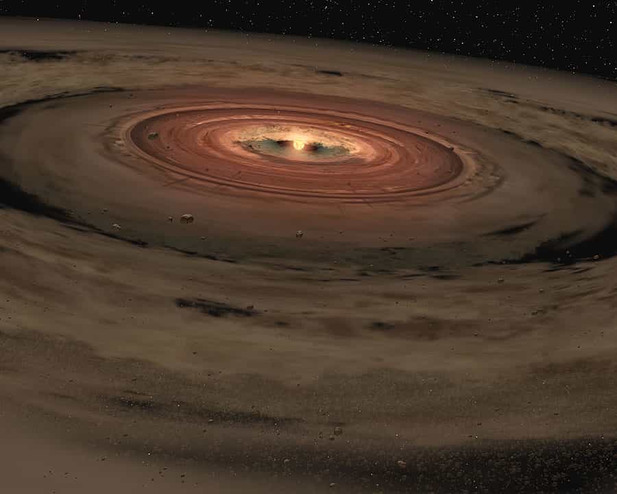 Une vision d'artiste du disque protoplanétaire de notre Système solaire. Les planètes qui y naîtront bouclent leurs orbites dans le même sens, celui de la rotation du Soleil sur lui-même. Les lois de la mécanique imposent que le nuage qui s'est effondré gravitationnellement pour donner ce disque devait être en rotation. © Nasa, JPL-Caltech