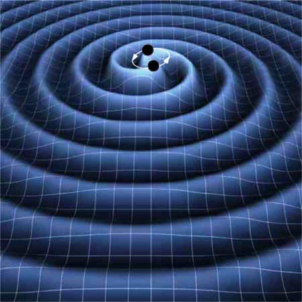 Une représentation d'artiste des ondes gravitationnelles se propageant dans le tissu de l'espace-temps et rayonnées par un couple de trous noirs spiralant l'un vers l'autre en perdant de l'énergie suite à l'émission de ces ondes. Crédit : K. Thorne (Caltech)-T. Carnahan (Nasa GSFC)