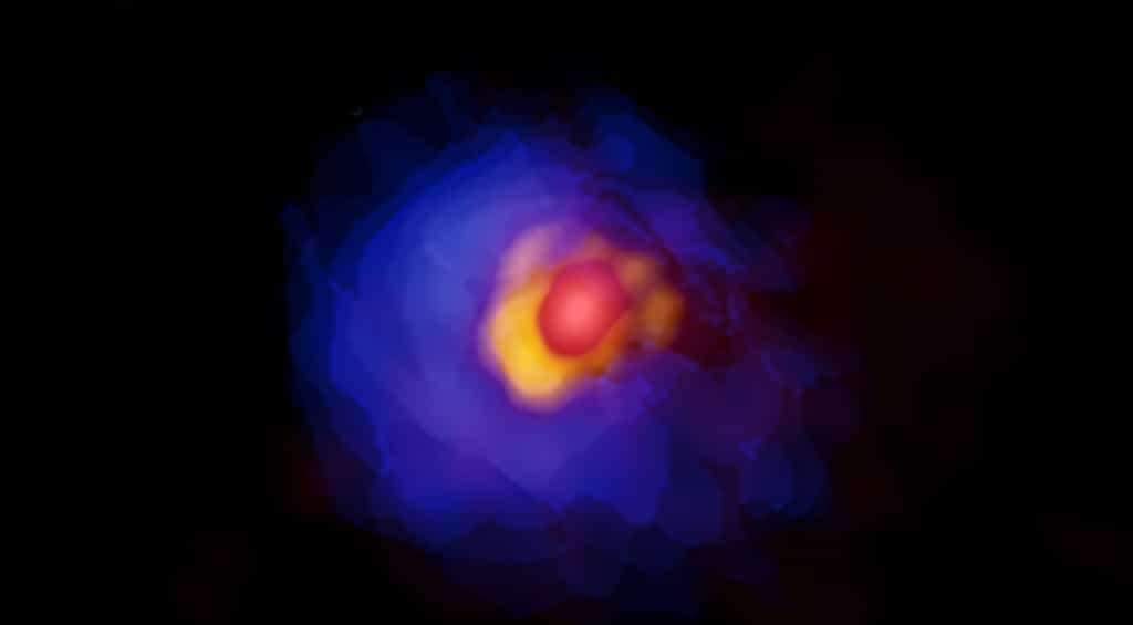 Image d'Alma de la proto-étoile massive G353.273 + 0.641. Les émissions de la proto-étoile centrale, du disque et de l’enveloppe gazeuse sont indiquées en rouge, jaune et bleu. L'asymétrie dans le disque est clairement montrée avec les observations Alma haute résolution. © Alma (ESO/NAOJ/NRAO), Motogi et al.
