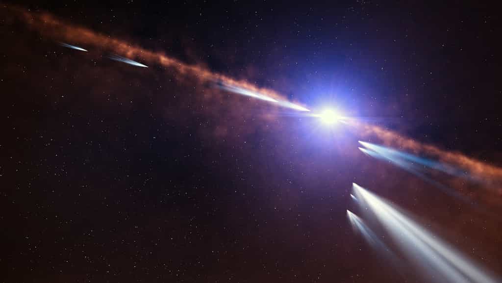 Cette vue d'artiste montre des exocomètes en orbite autour de l'étoile Beta Pictoris. L'analyse des observations de quelque 500 comètes distinctes effectuées au moyen de l'instrument Harps, qui équipe l'Observatoire de La Silla de l'ESO, a permis aux astronomes de classer les exocomètes situées non loin de cette jeune étoile en deux familles. La première famille se compose d'exocomètes âgées ayant effectué de multiples passages à proximité de l'étoile. La seconde famille, objet précis de cette illustration, est constituée d'exocomètes plus jeunes situées sur une même orbite, ce qui suggère leur origine commune : la récente fragmentation d'un ou plusieurs objets de plus vastes dimensions. © ESO, L. Calçada