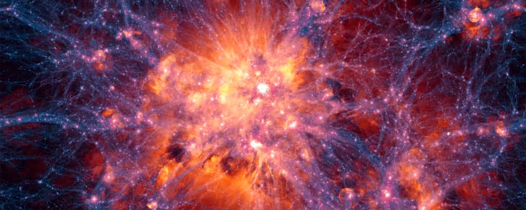 Les protons perdus du Big Bang ont-ils enfin été retrouvés ? Ici, projection à grande échelle centrée sur l’amas de galaxies le plus massif dans la simulation Illustris. Elle montre la distribution de la matière noire en filaments (bleu, violet et pourpre), laquelle interagit gravitationnellement avec la matière ordinaire et favorise la formation des amas de galaxies. Les enveloppes de gaz teintées de rouge, rose ou orange sont principalement créées par l’explosion de supernovae ou les jets des trous noirs supermassifs. © Illustris Collaboration