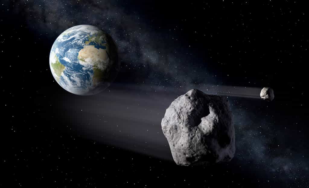 Cette vue d'artiste montre des astéroïdes aux environs de la Terre. Les experts de l'Esa souhaitent coordonner leurs efforts en matière de détection et éventuellement de déviation de ces objets dangereux. © P. Carril, Esa