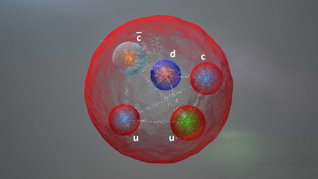 La nouvelle particule découverte avec le détecteur de la collaboration LHCb est un état lié formé de quatre quarks et d'un antiquark, un pentaquark. Une des hypothèses initiales concernant sa structure est représentée sur ce dessin d'artiste. © Daniel Dominguez, Cern