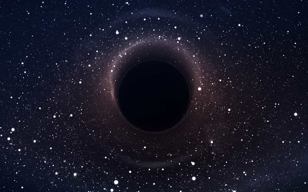 Au centre de la Voie lactée, il y a un objet massif que les astronomes appellent Sagittariaus A*. Ils pensaient qu’il s’agissait d’un trou noir supermassif. Mais une équipe du Centre international d’astrophysique relativiste (Italie) suggère aujourd’hui qu’il pourrait s’agir d’une masse de matière noire. © Vadimsadovski, Adobe Stock