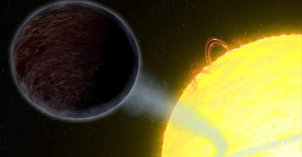 La planète Wasp 12b est noire sur cette image d'artiste. Elle orbite si près de son étoile que cette Jupiter chaude perd de la matière du fait des forces de marée. Le courant gazeux qui s'en échappe forme un filament bleuté autour de Wasp 12a, l'étoile hôte. © Nasa, ESA, G. Bacon (STScI)