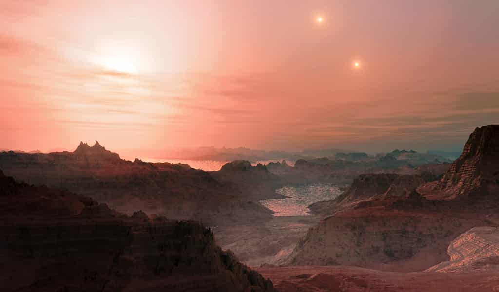 Vue d'artiste d'une planète habitable comme il en existe peut-être autour de Proxima du Centaure, une naine rouge. On peut voir deux étoiles au loin car cette naine rouge fait partie d'un système triple d'étoiles. © ESO/L. Calçada
