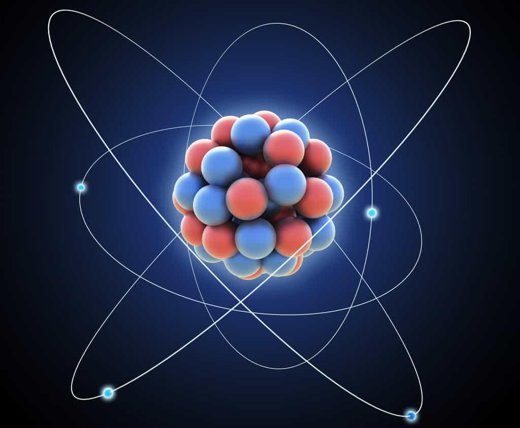 Les noyaux des atomes contiennent des nucléons (bleus et rouges sur cette image d'artiste), c'est-à-dire des protons et des neutrons. Il est possible de fabriquer sur Terre des noyaux plus lourds que ceux de l'uranium avec 92 protons et des centaines de neutrons pour ses isotopes en faisant fusionner des noyaux lourds, par exemple avec des faisceaux d'ions calcium bombardant d'autres éléments dans une cible au repos. © Mopic, Shutterstock