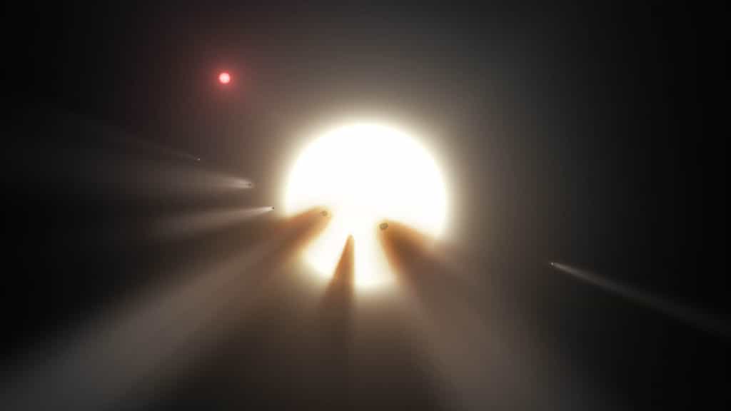 Illustration de l’environnement supposé de l’étoile KIC 8462852. Pour expliquer les séries d’occultations irrégulières survenues en 2011 et en 2013 – jusqu’à 22 % de la lumière de l’astre bloquée (un record) –, les chercheurs avancent l’hypothèse qu’un important cortège de comètes en serait responsable. © Nasa, JPL-Caltech