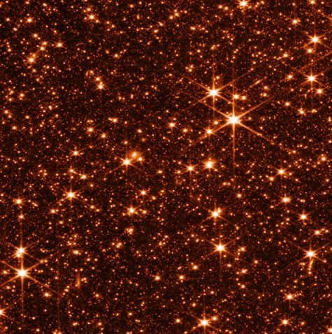 Pourquoi les images sont-elles monochromatiques ? Tout simplement car chaque prise a été prise en regardant que dans une seule longueur d'onde. Ici, une partie du Grand Nuage de Magellan prise par l'instrument NIRCam à 2 microns. © Nasa, STScI