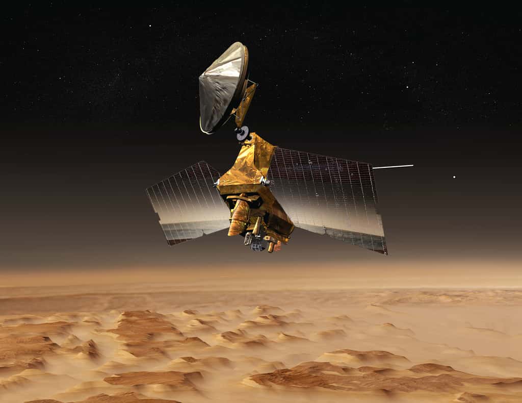 Vue d'artiste de la sonde <em>Mars Reconnaissance Orbiter</em> au-dessus de la planète Mars. © Nasa