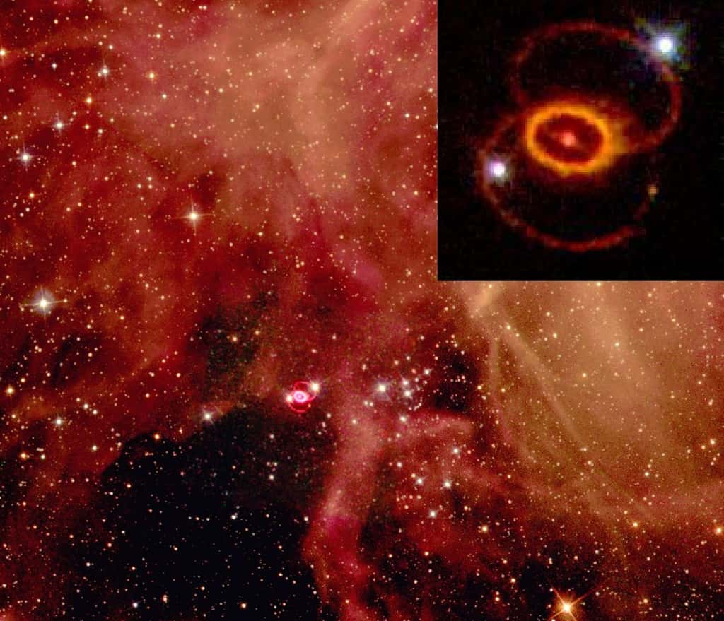 Le rémanent de la supernova SN 1987A dans le Grand Nuage de Magellan, hors de notre Galaxie, est observé de plus près par le télescope spatial Hubble en haut à droite de cette image. Les deux points brillants sont des étoiles d'avant-plan. Sur les trois anneaux visibles, l'anneau central délimite l’extension actuelle du rémanent. Les anneaux extérieurs, plus grands et plus faibles, résultent de phénomènes de perte de masse antérieurs à la supernova. © Nasa, Wikipédia, DP