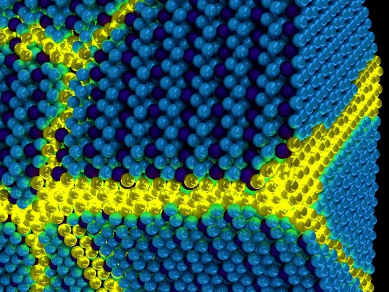 Une vue d’artiste de l’excitonium, comme une excitation en jaune qui se propage dans un solide d’excitons en bleu. © Peter Abbamonte, <em>University of Illinois</em>, <em>Department of Physics</em> et Frederick Seitz, <em>Materials Research Laboratory</em>