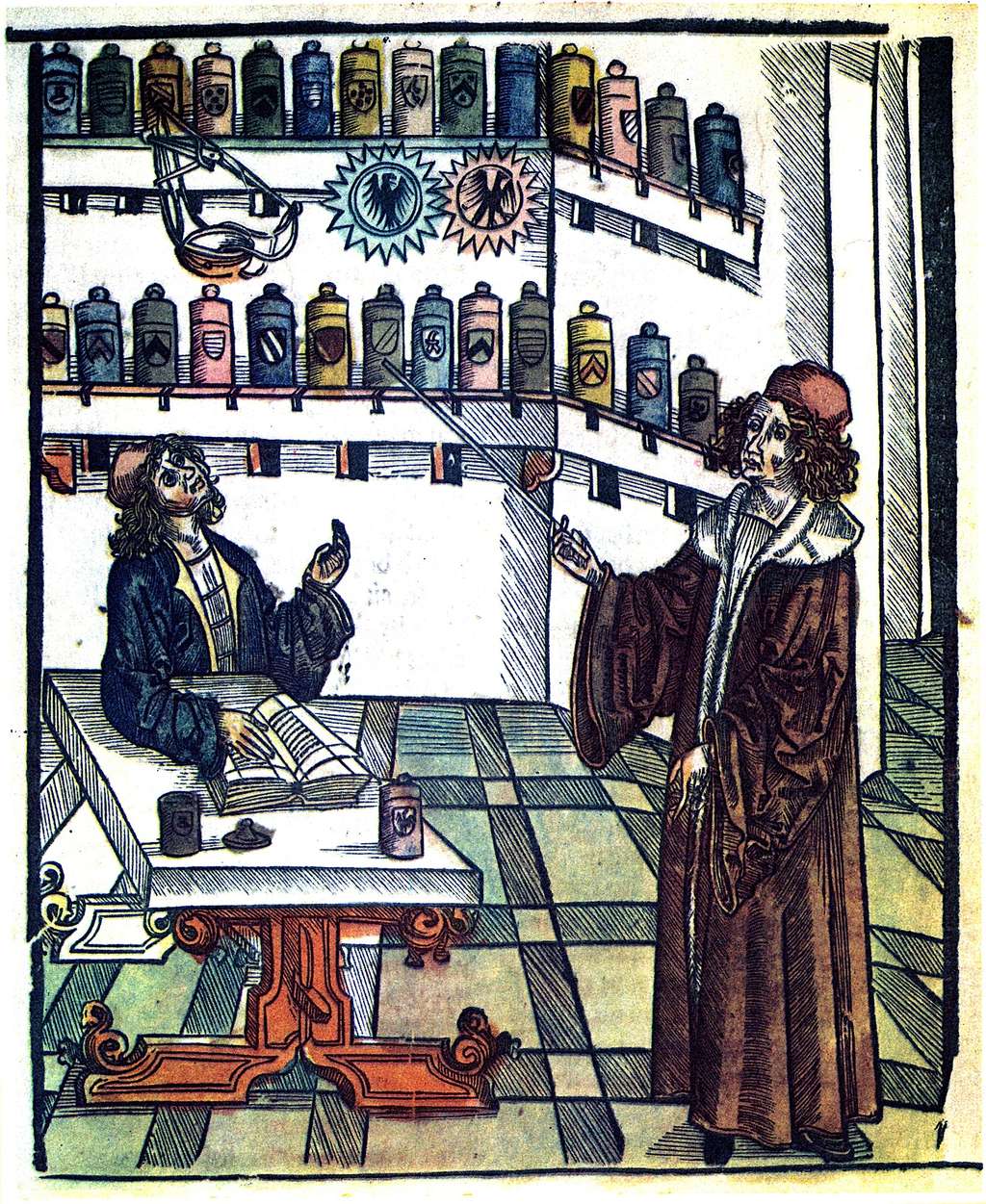 Représentation d'un maître apothicaire donnant la leçon à son apprenti, extrait de <em>Das Buch der Gesundheit</em> (le livre de la santé) par Hieronymus Brunschwig, édité à Strasbourg vers 1505. © <em>Wikimedia Commons</em>, domaine public